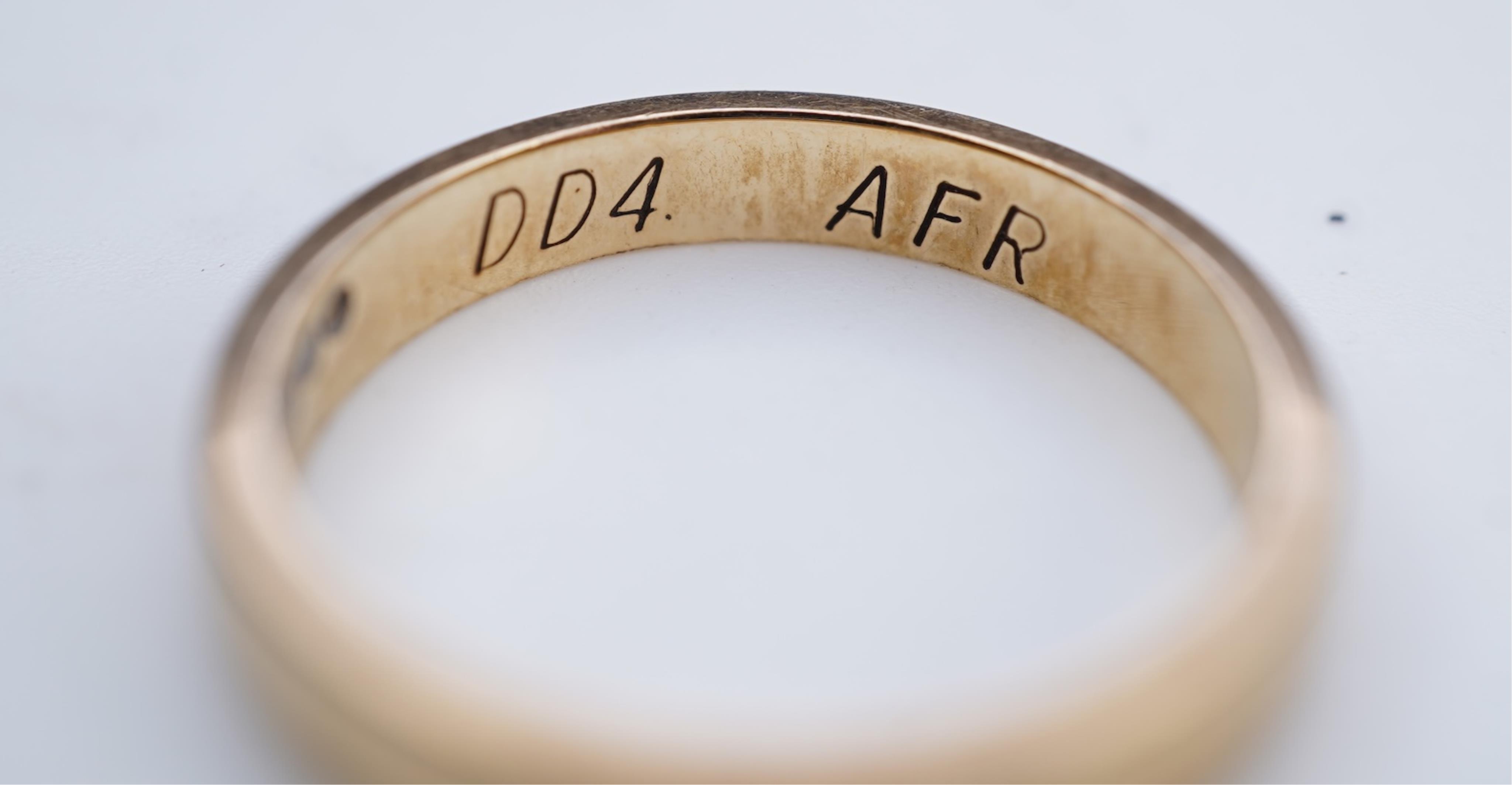 A collection of six gold wedding bands